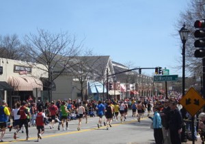 2011 boston marathon runners enter wellesley square
