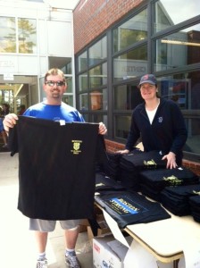 Lt. Cleary (right) with a T-shirt customer (photo by Jim Jones)
