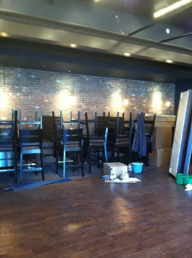 Dining area: Stacked tables and chairs, longing to receive hungry customers.