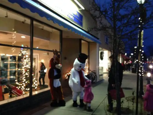 Rudolph & Frosty chat with a young friend in Wellesley Square