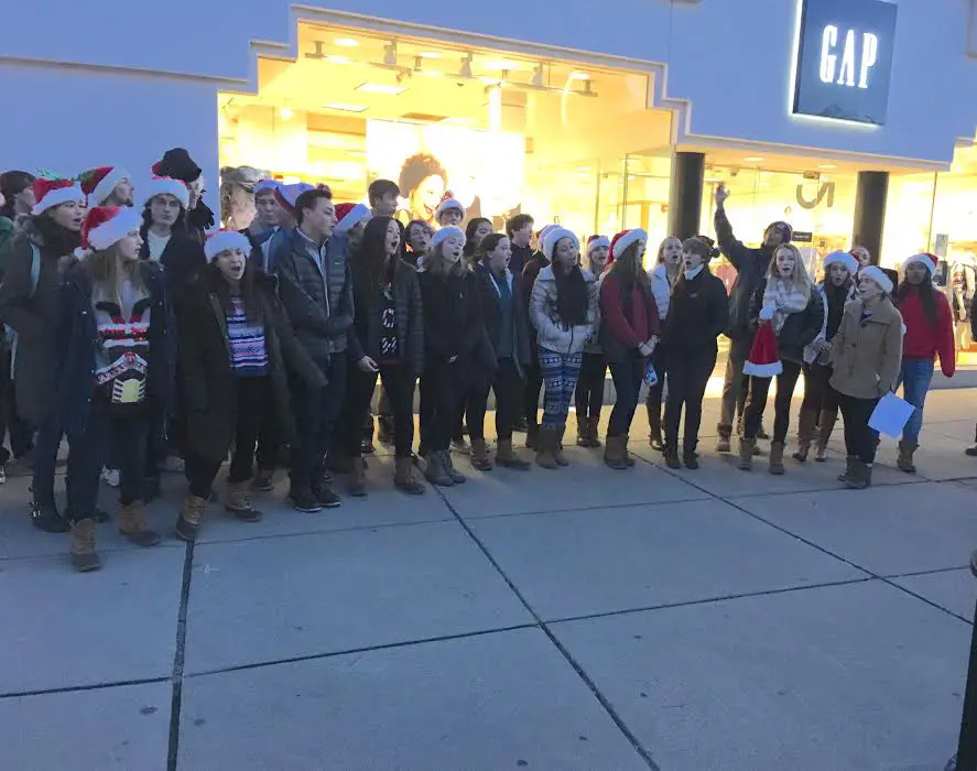 The Wellesley High School Choral singers belt out some holiday tunes. They roamed Wellesley Square, singing their hearts out from noon - 6pm. Indentured song-itutde? Thanks to reader CH for this photo.