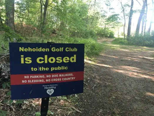 wellesley college closed covid sign nehoiden