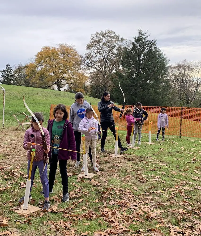 Girl Scout Troop 73505 doing archery