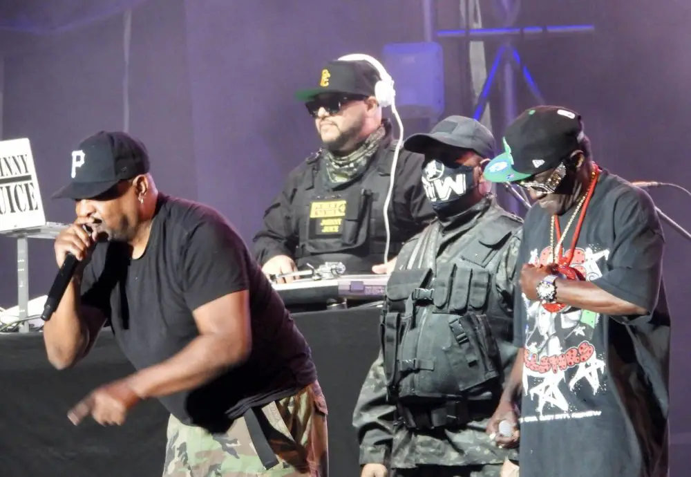 Chuck D leans in alongside Flavor Flav at Boston Calling