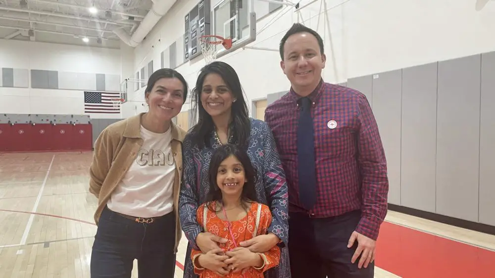 International-night photo of 3 adults, 1 child